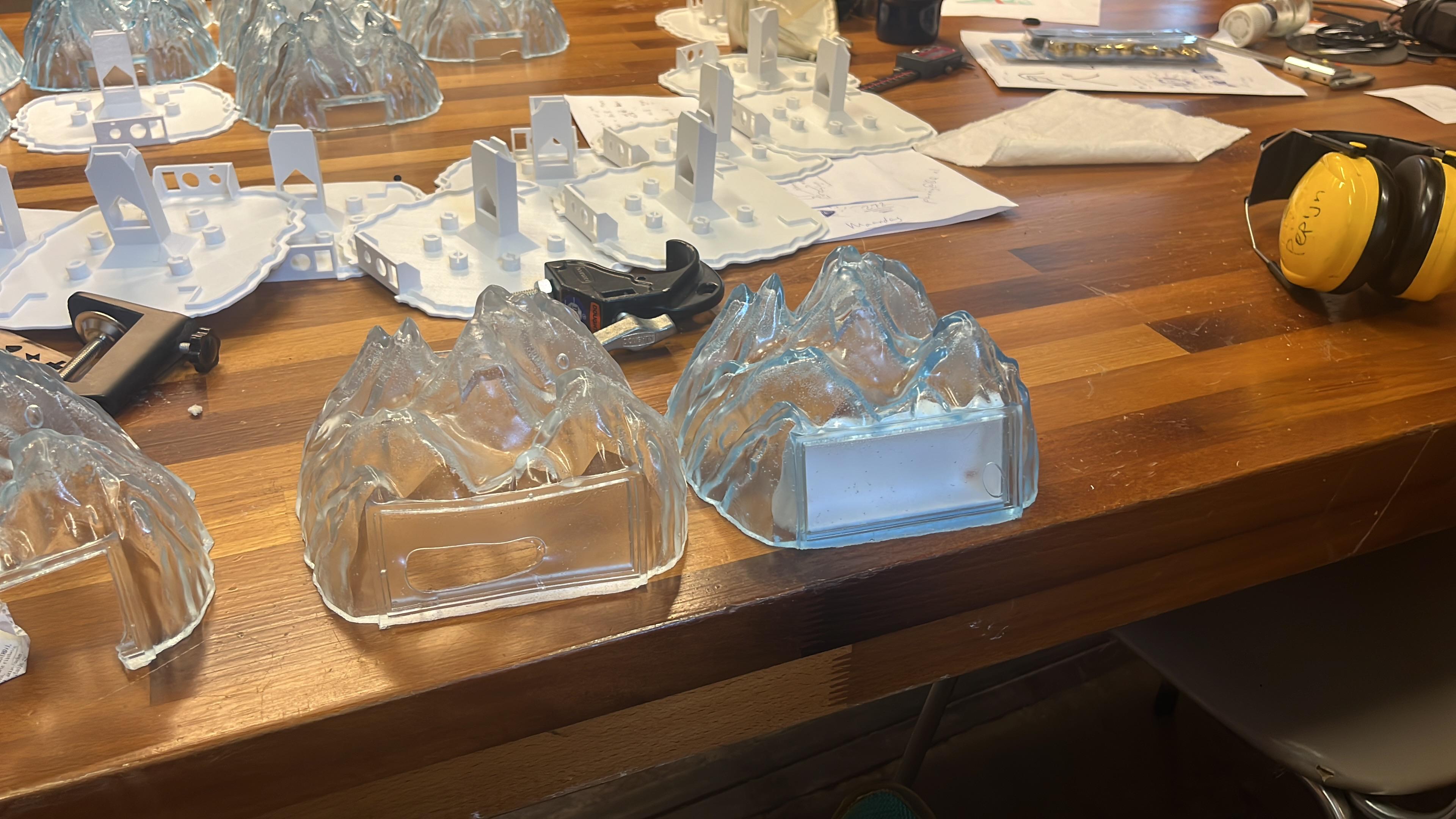 Early base castings with different inserts and electronic components under test